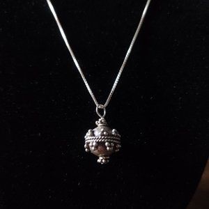 Silver necklace with decorative pendant